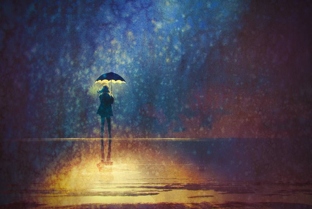 Samotna dziewczyna w deszczu.