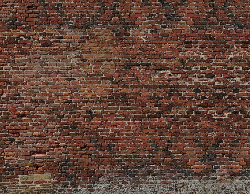 Stary odrestaurowany mur z cegły