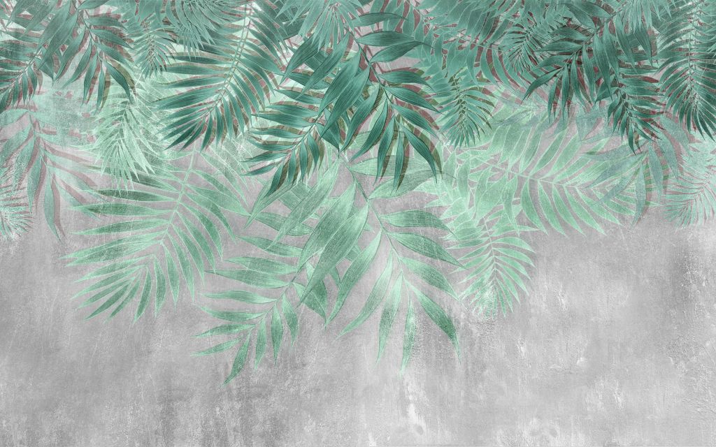 Zielone liście palmy z szarą betonową ścianą