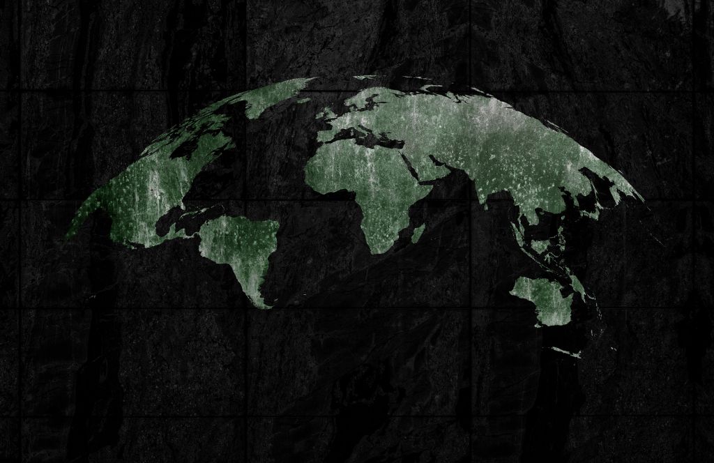 Zielona mapa świata na betonie