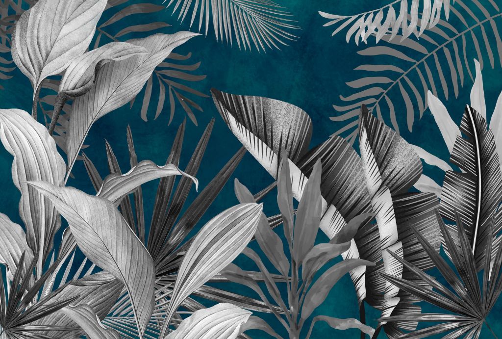Tropikalne liście na niebieskim tle